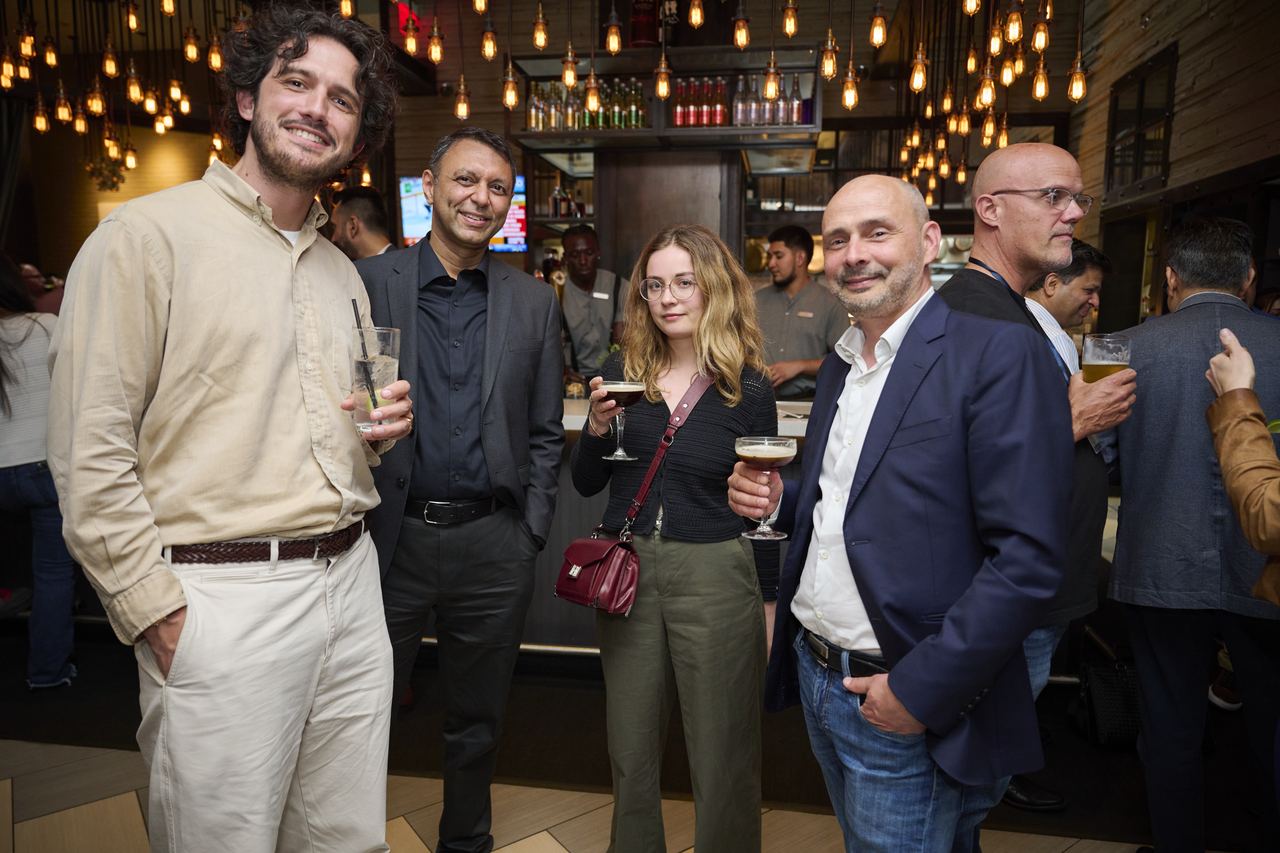Attendees talking at the 2025 evening reception
